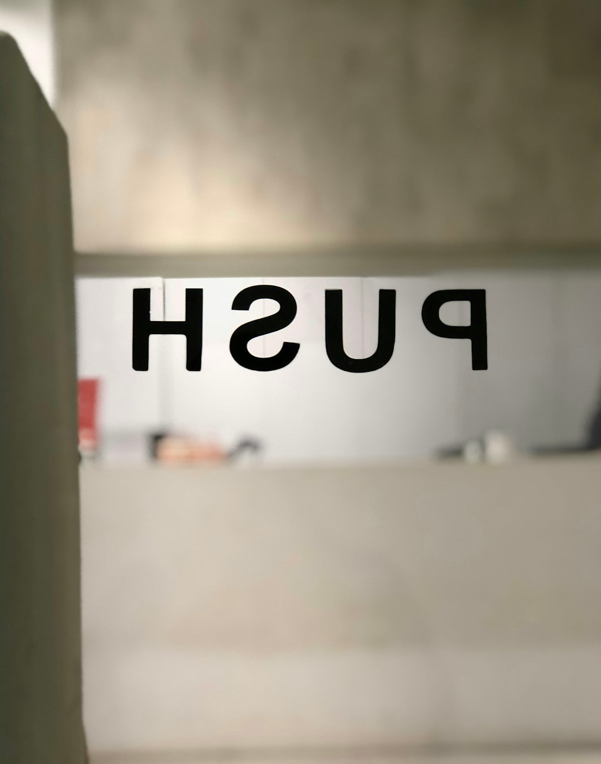 a bathroom with a push sign on the wall