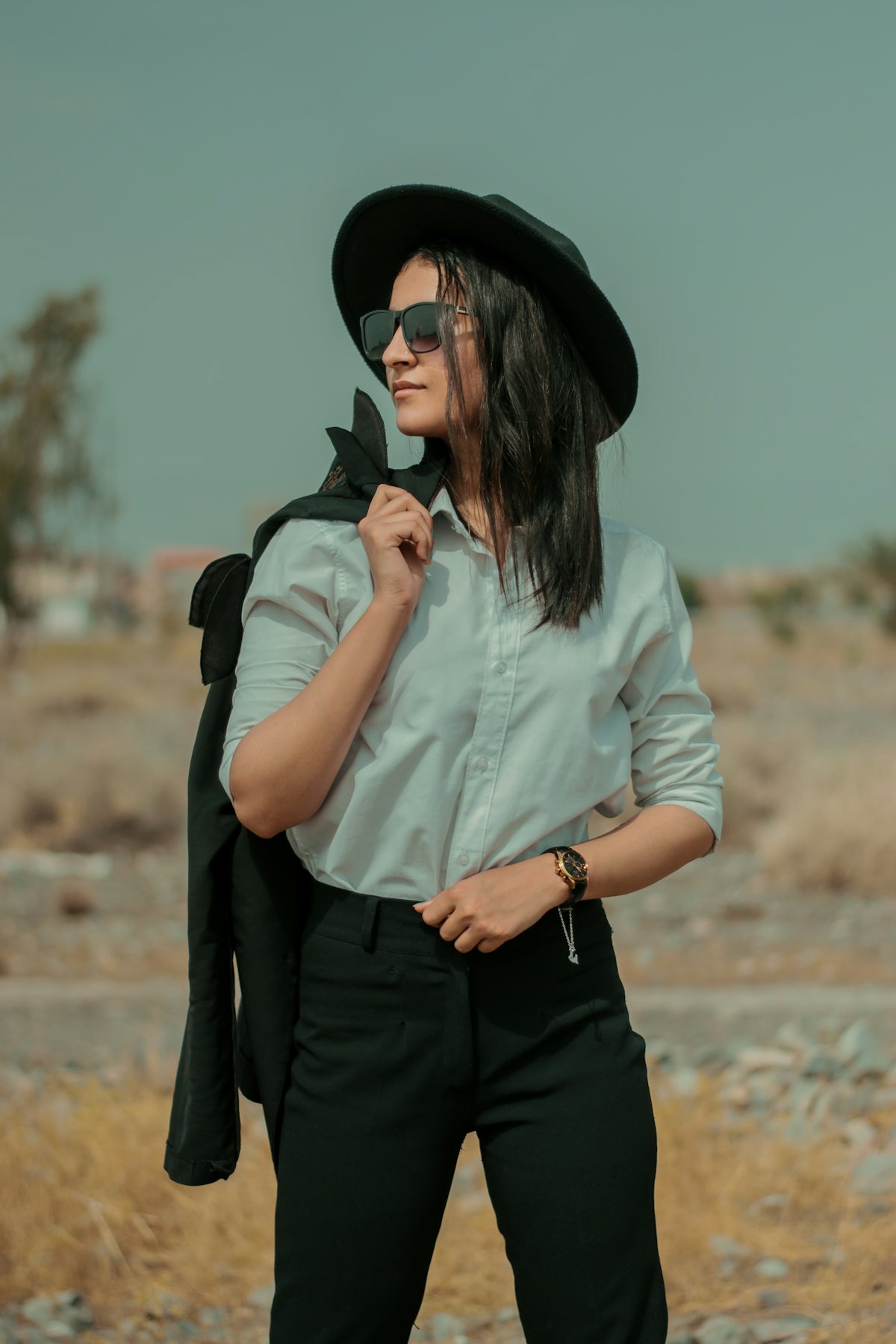a person wearing a hat and sunglasses