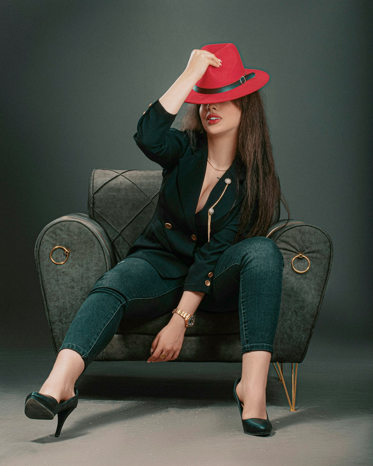 a woman in a red hat sitting on a chair