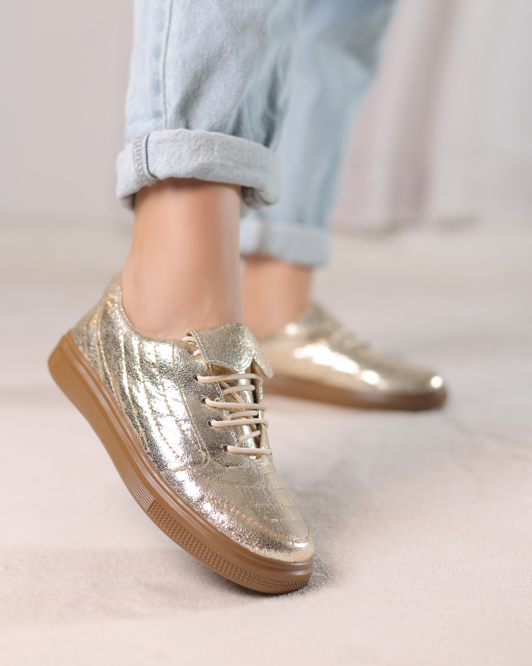 Aurora Gold Luxe Sneakers metallic gold low-top lace-up sneakers 1