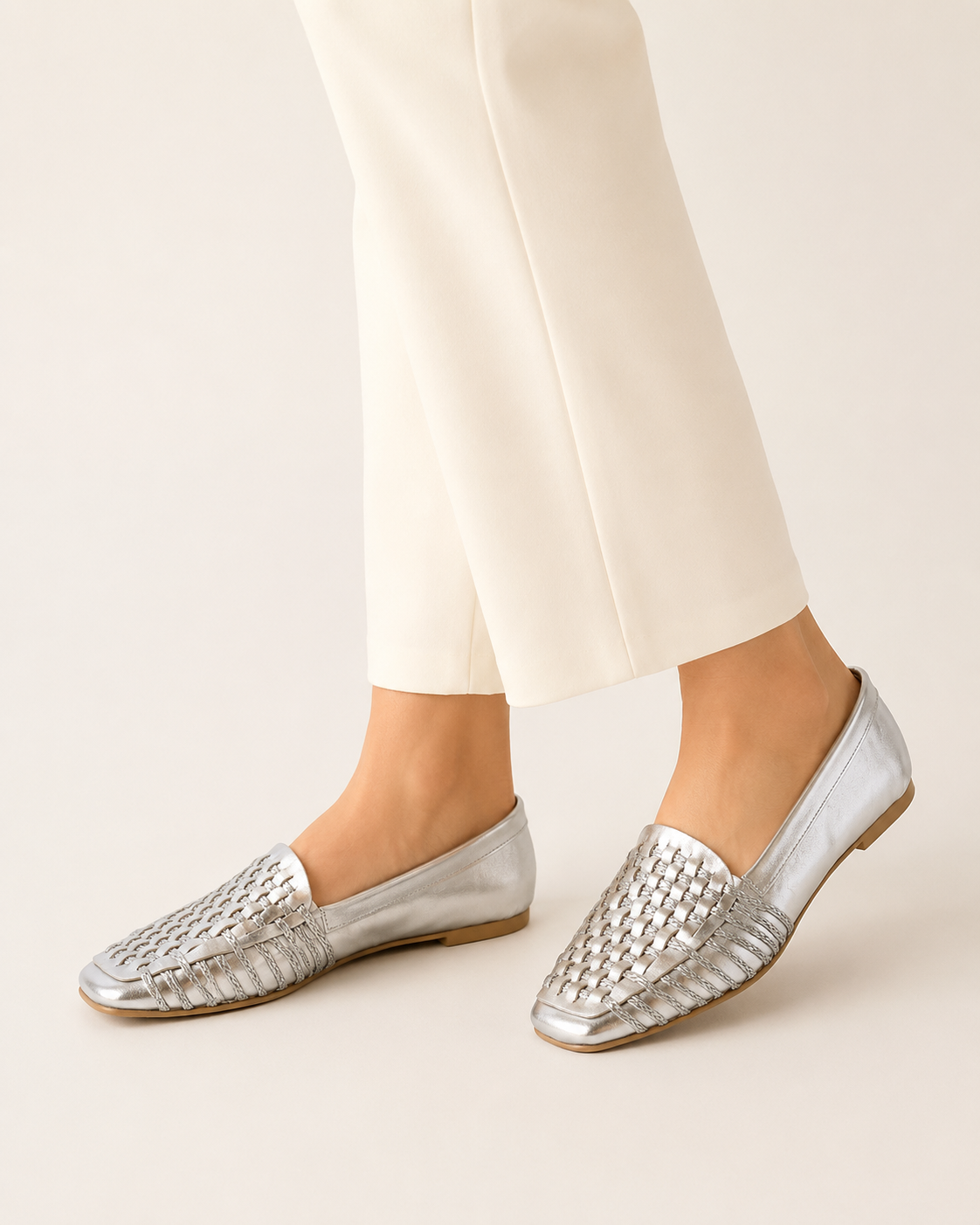 The Romy Woven Loafer - Silver metallic woven loafer close-up on foot