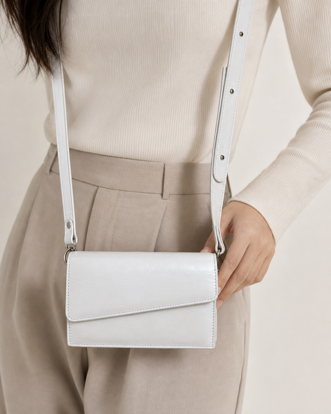 Ivora white glossy rectangular flap shoulder bag on female model - view 3