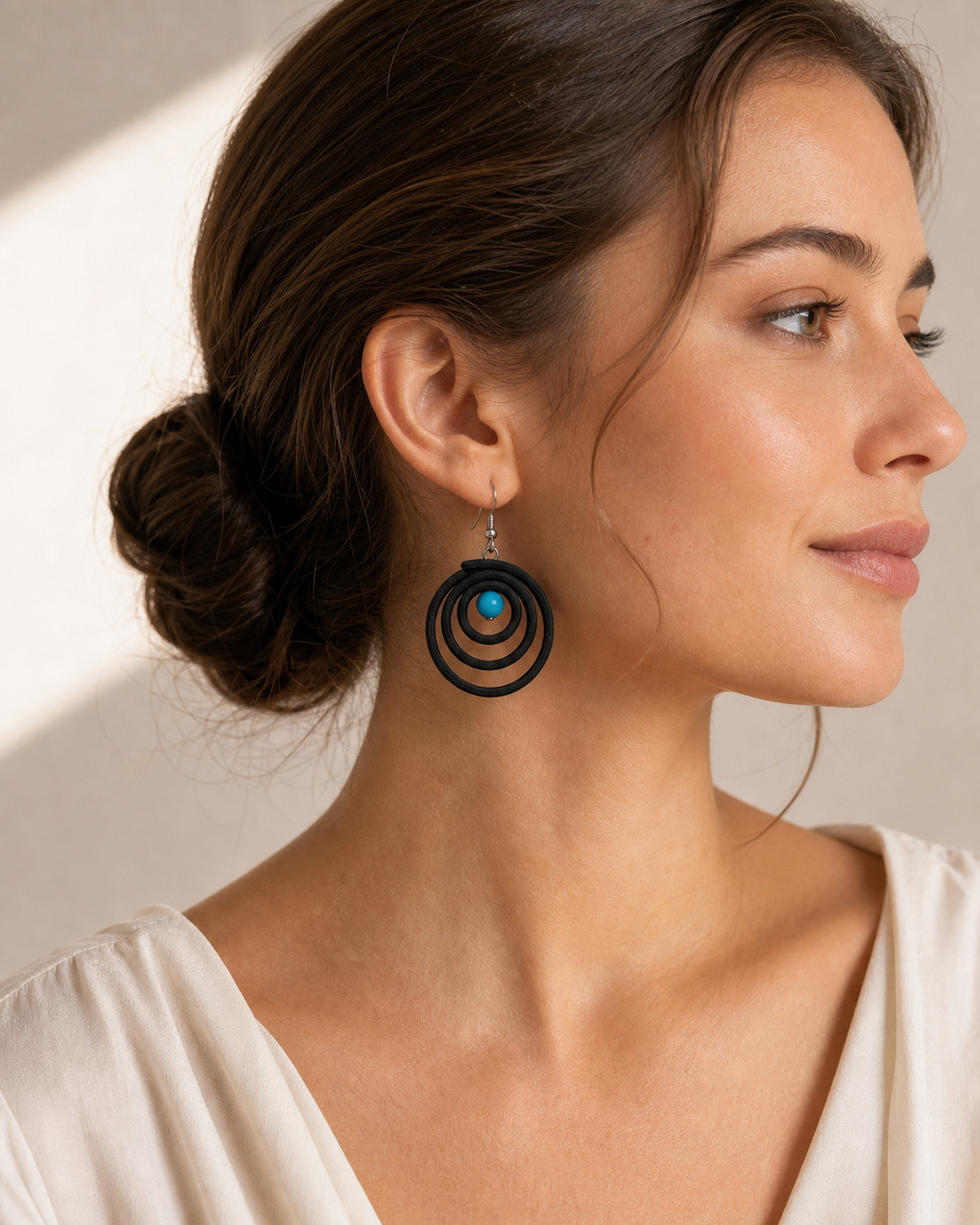 Noir Tide black spiral drop earrings with silver hook and turquoise blue bead - view 2