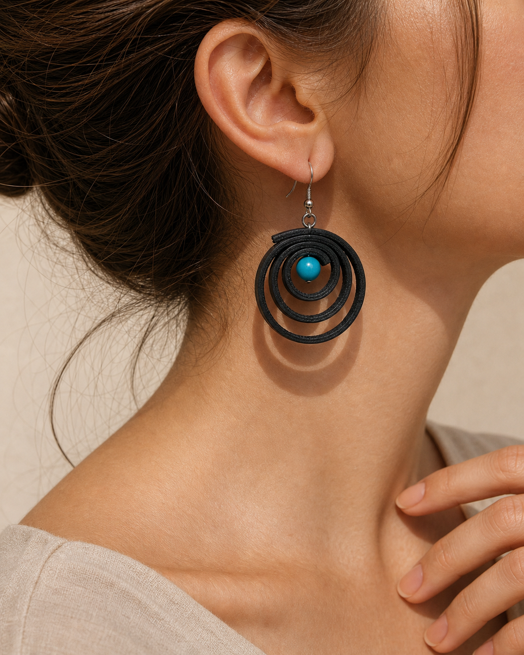 Noir Tide black spiral drop earrings with silver hook and turquoise blue bead - view 3
