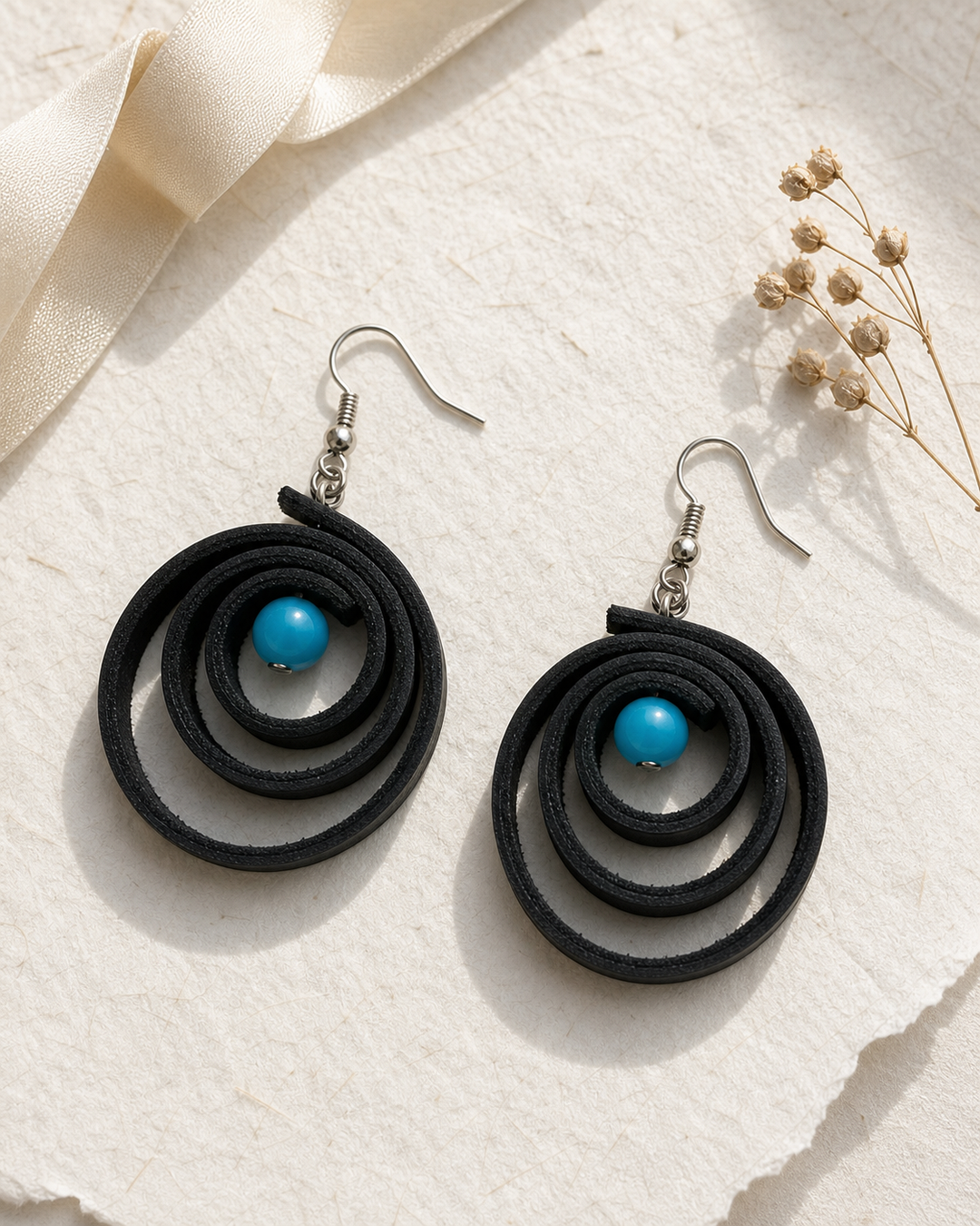 Noir Tide black spiral drop earrings with silver hook and turquoise blue bead - view 4