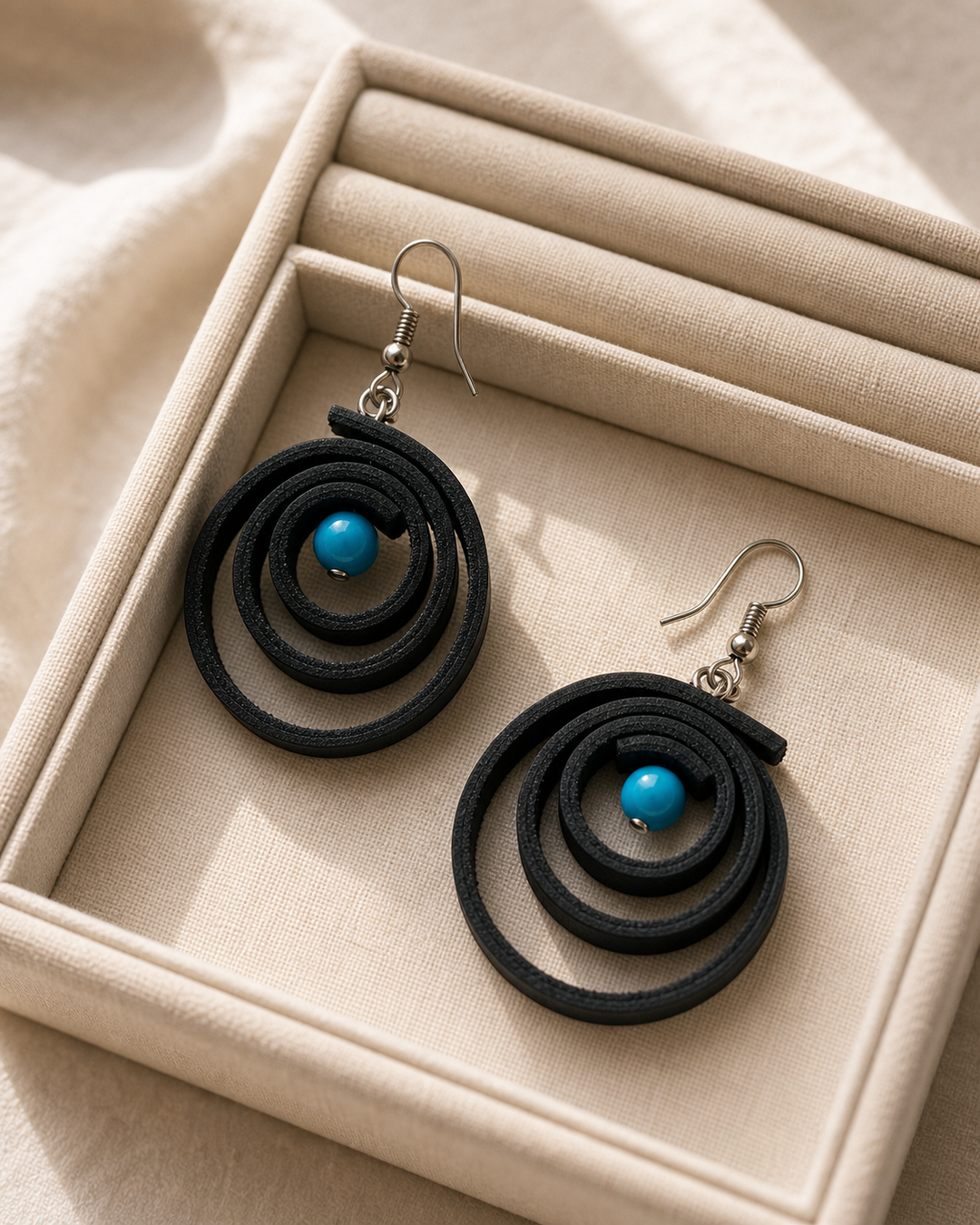 Noir Tide black spiral drop earrings with silver hook and turquoise blue bead - view 5