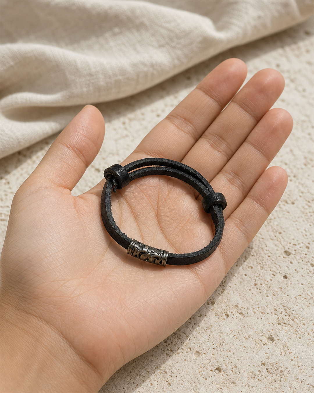 Ravelle black leather cord bracelet with silver tube charm on female model - view 3