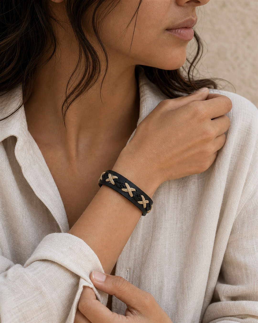 Serrin black leather cuff bracelet with cream X-stitch lacing on female model - view 5
