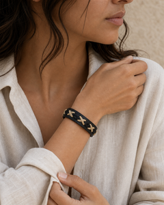 Serrin black leather cuff bracelet with cream X-stitch lacing on female model - view 5