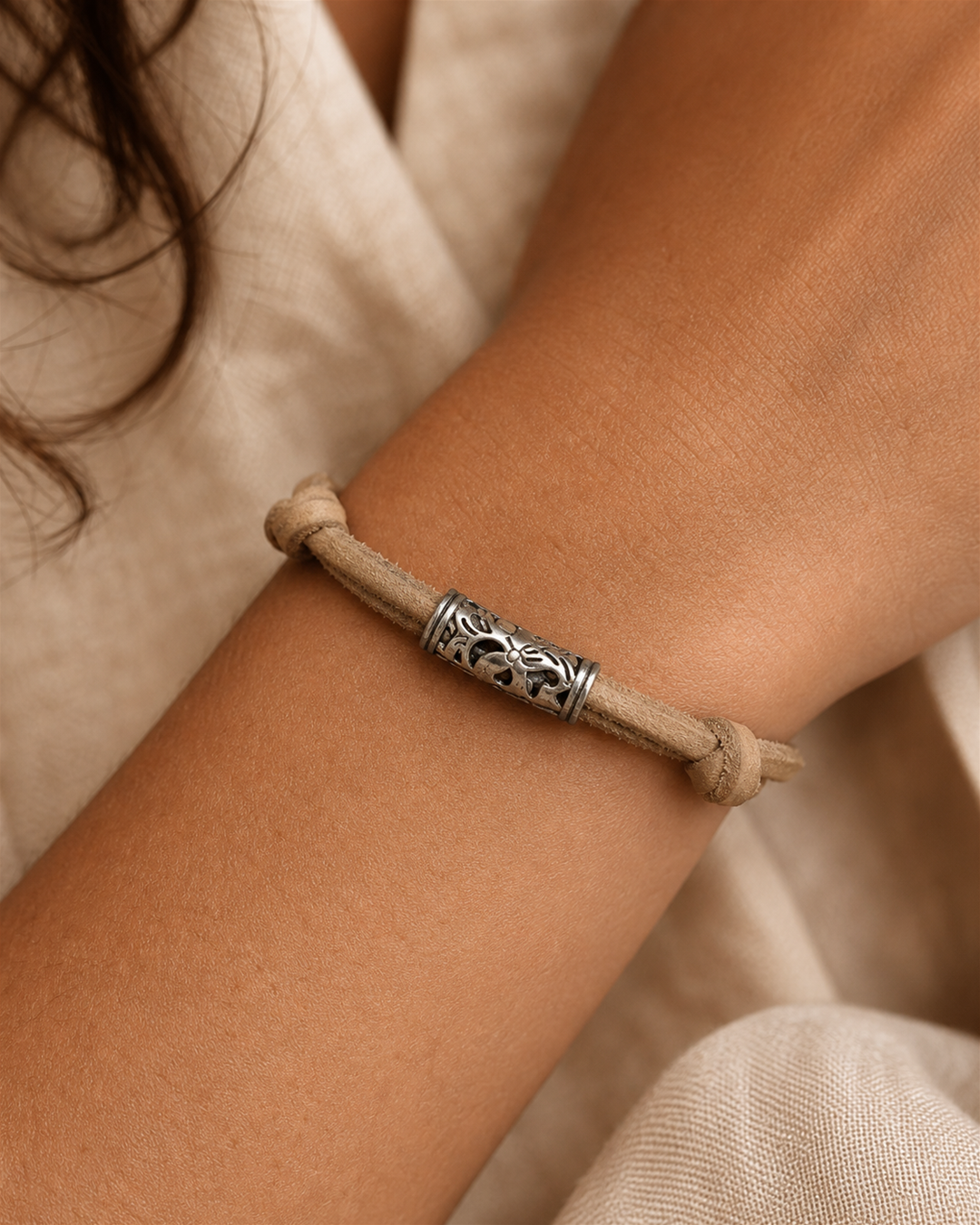 Tavira tan leather cord bracelet with silver tube charm on female model - view 4