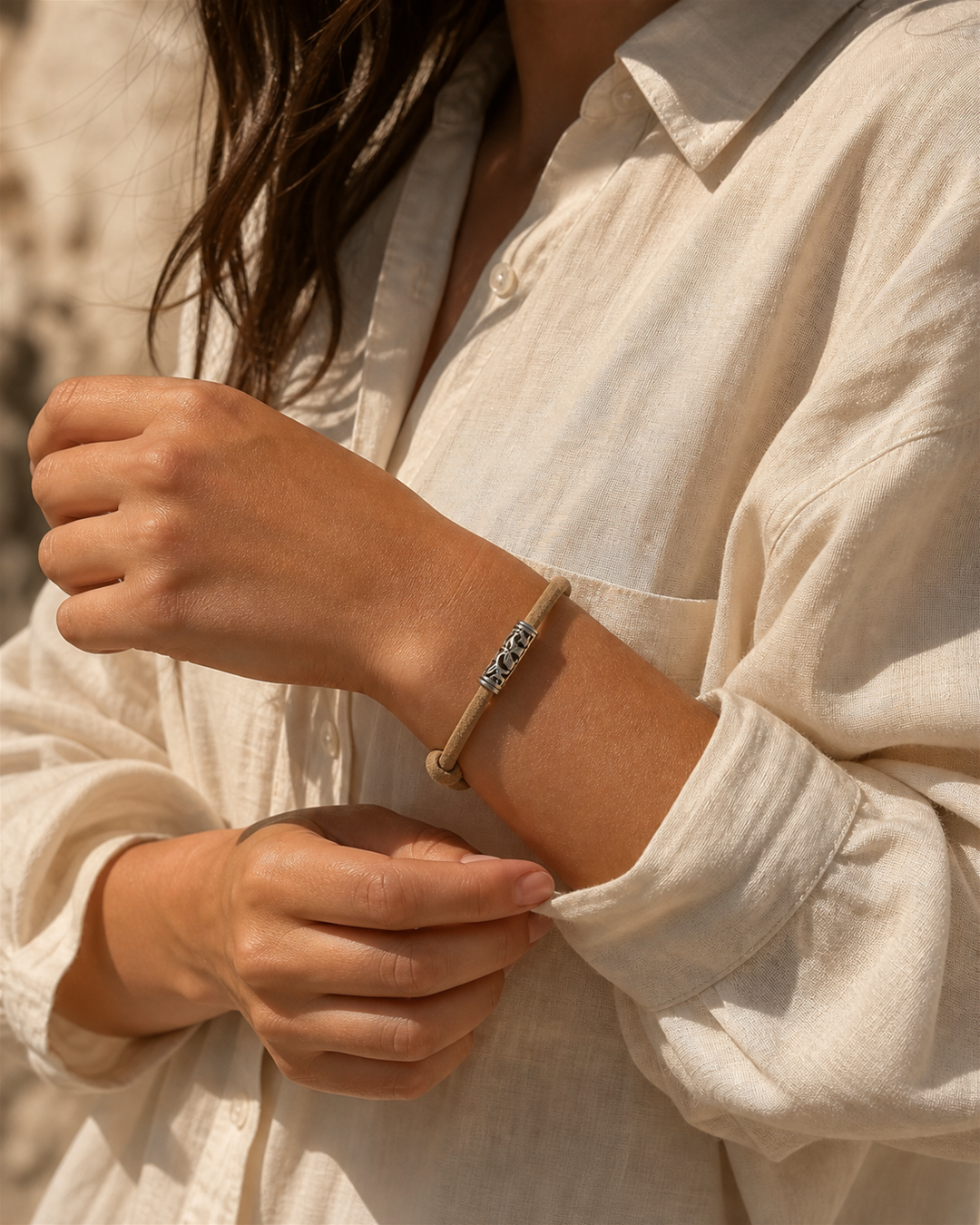 Tavira tan leather cord bracelet with silver tube charm on female model - view 5