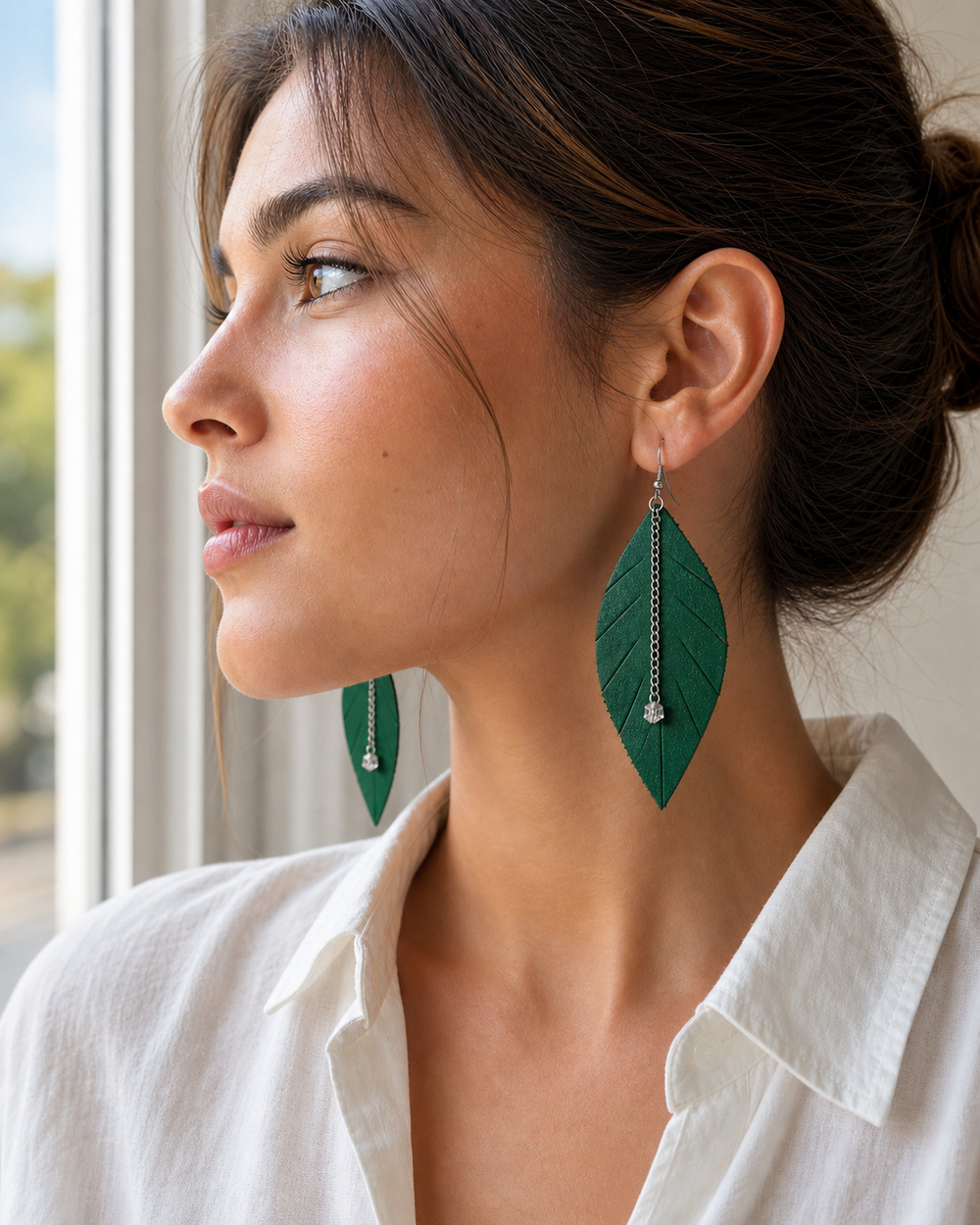 Side profile of model wearing The Emerald Leaf Earrings