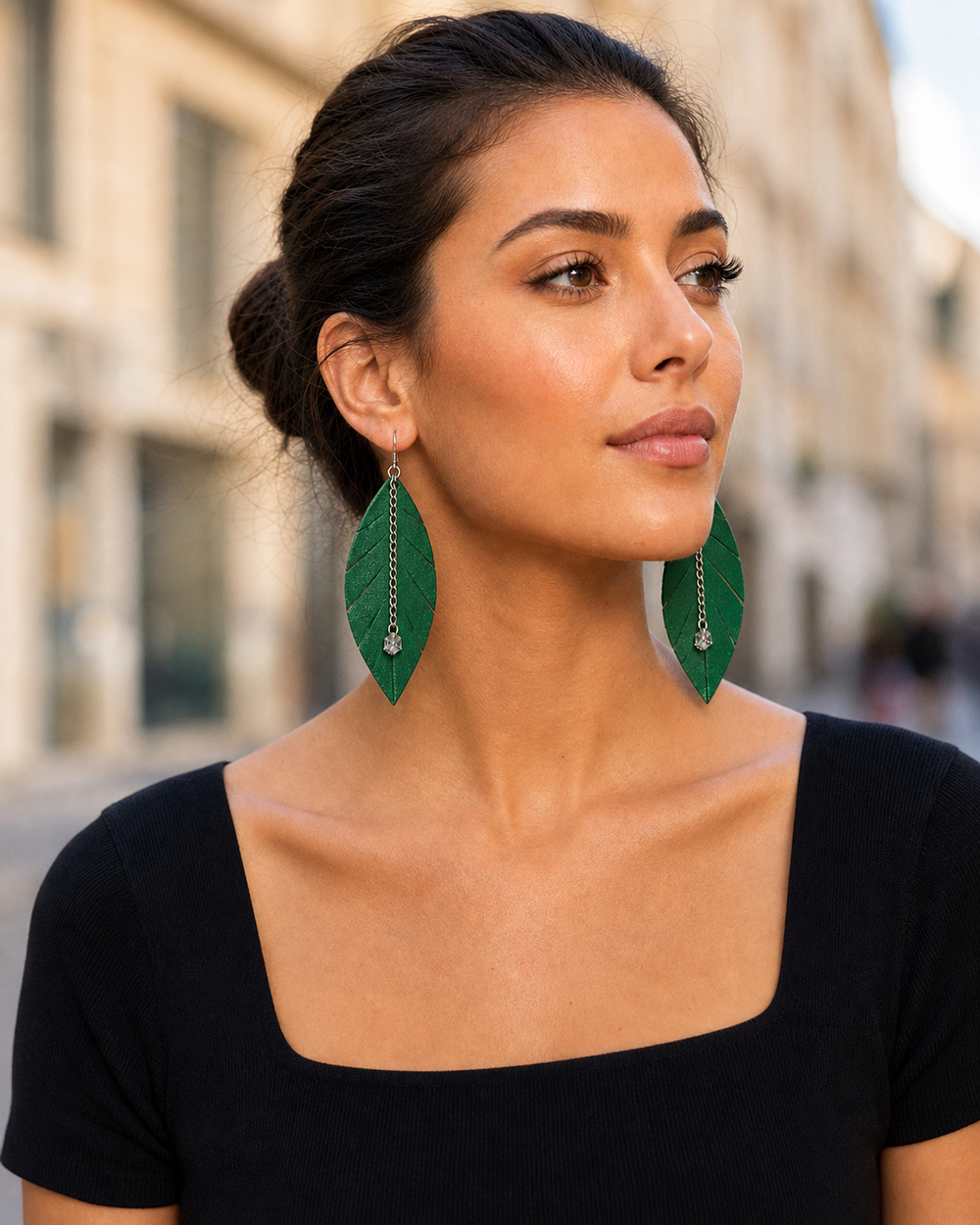 Outdoor lifestyle portrait featuring The Emerald Leaf Earrings