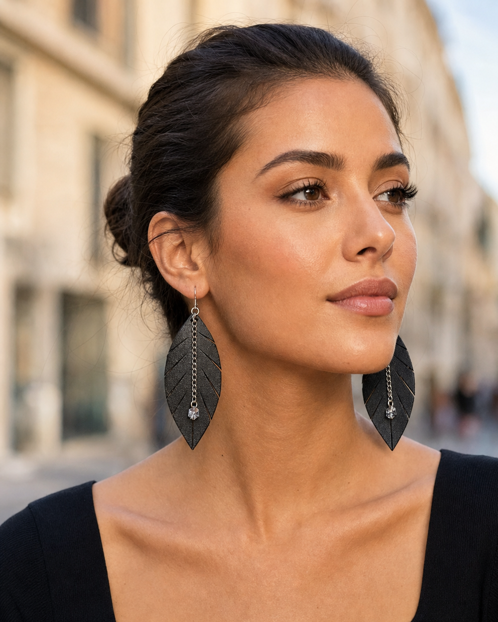 Outdoor lifestyle portrait featuring The Noir Leaf Earrings