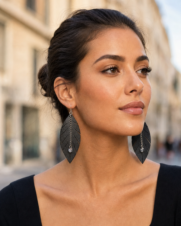 Outdoor lifestyle portrait featuring The Noir Leaf Earrings